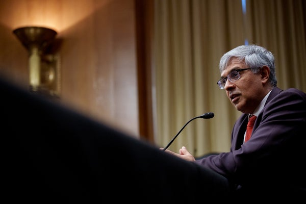 Jay Bhattacharya standing at lectern