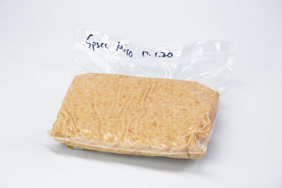 Photo of a clear plastic bag on a white surface, containing miso and labeled, "Space miso," in handwritten sharpie